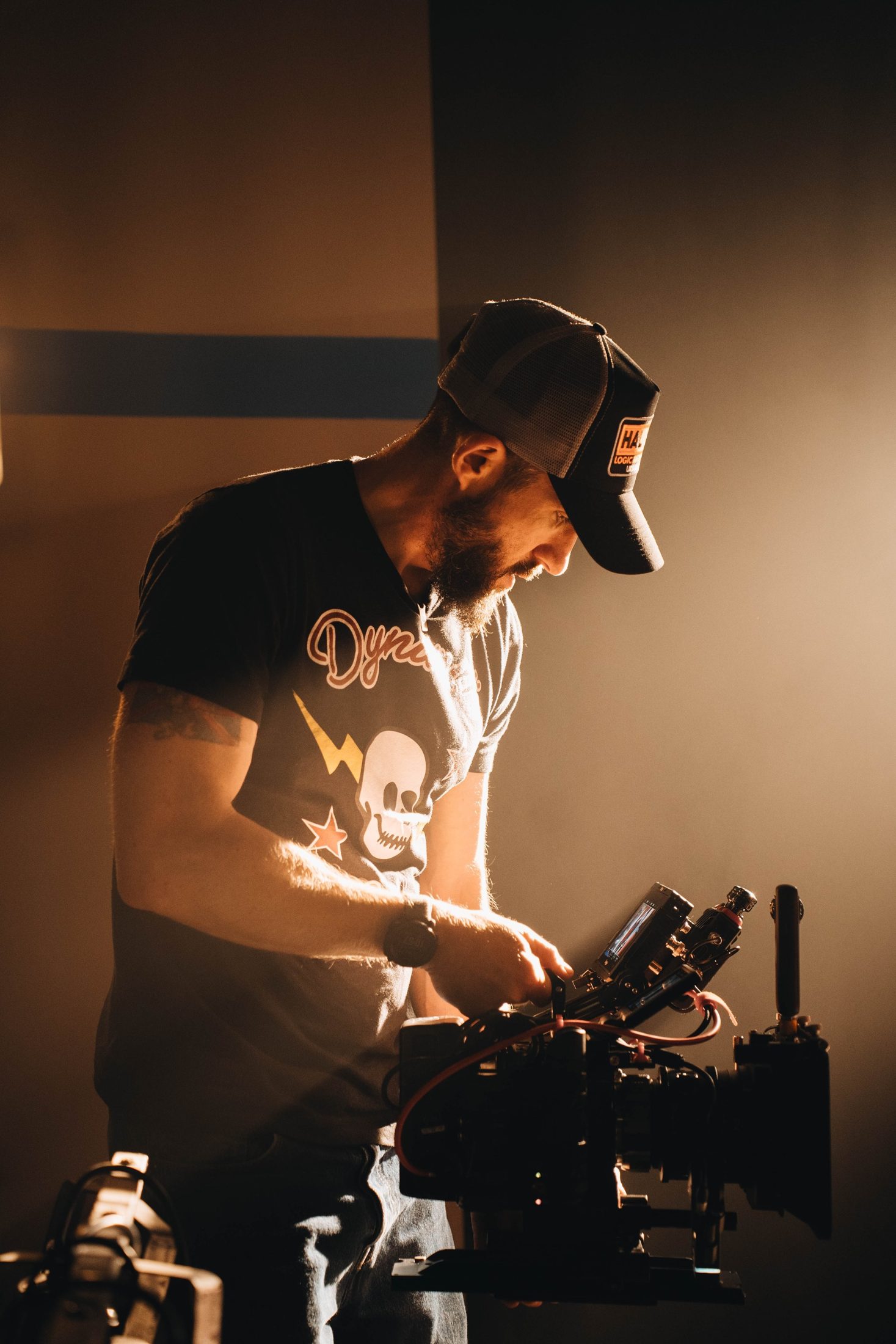 Lou Murrall, filmmaker and cinematographer, operating a cinema camera on set